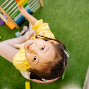 girl with abacus on grass