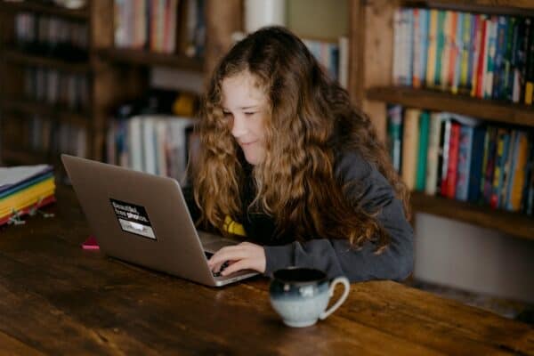 An image of a young girl studying for the PSAT.