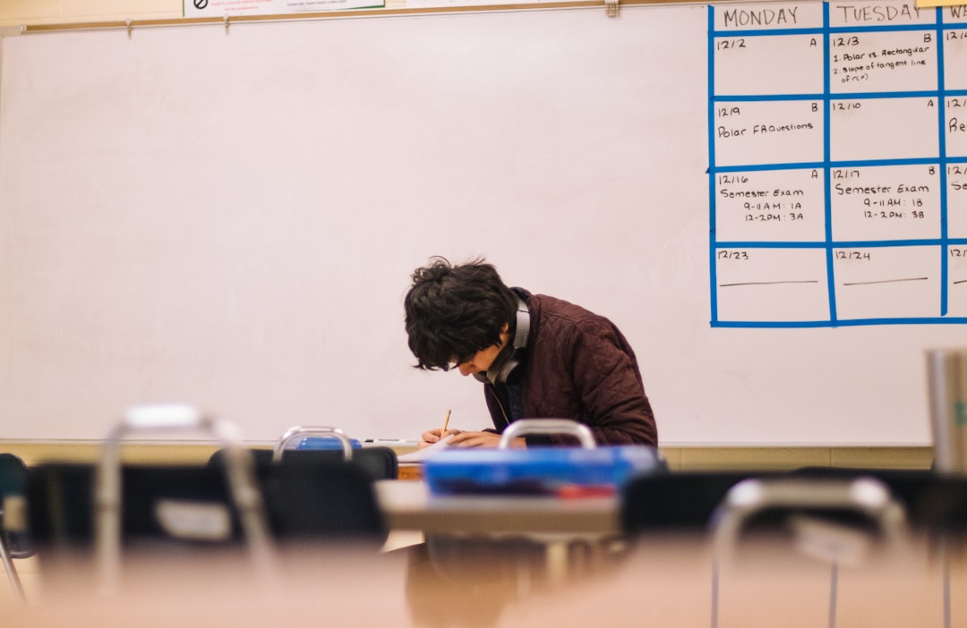 Student studying in classroom, representing 12th grade math learning and preparation